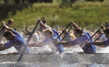 Dragon Boating team at The Lensbury Watersports Centre. Enjoyable and engaging outdoor team building events and activities in London