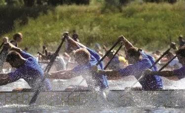 Dragon Boating team at The Lensbury Watersports Centre. Enjoyable and engaging outdoor team building events and activities in London