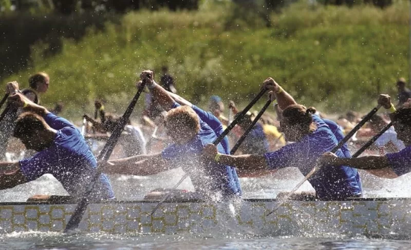 Dragon Boating team at The Lensbury Watersports Centre. Enjoyable and engaging outdoor team building events and activities in London