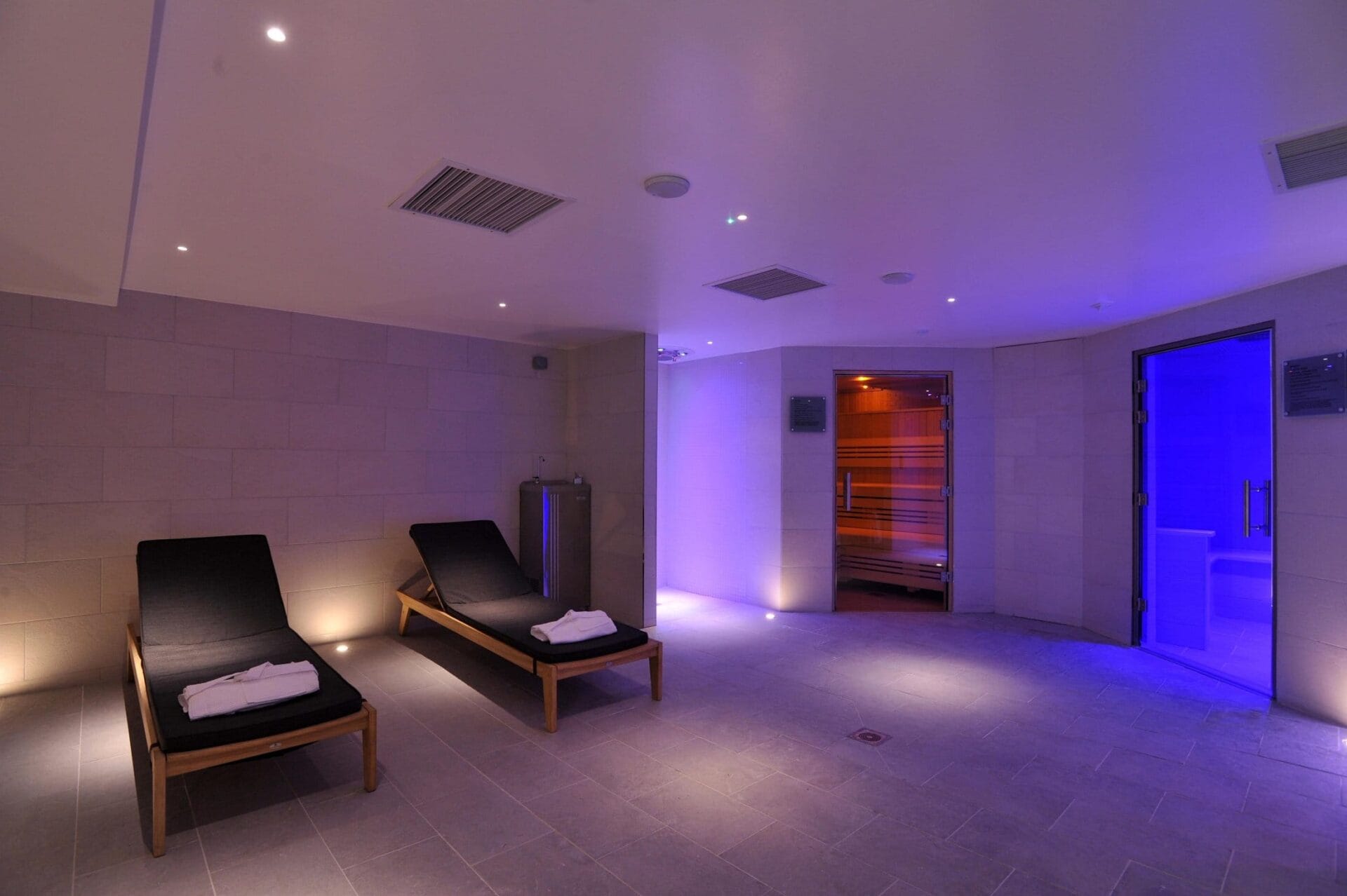 Thermal suite with 2 lounge chairs and sauna at The Lensbury Club fitness centre & gym in Teddington.