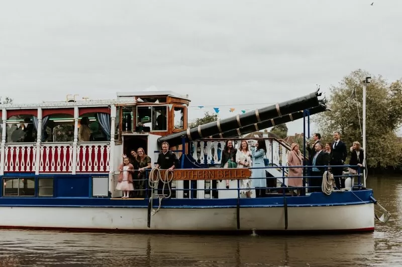 Wedding party on a river boat at The Lensbury a riverside wedding and reception package venue near me