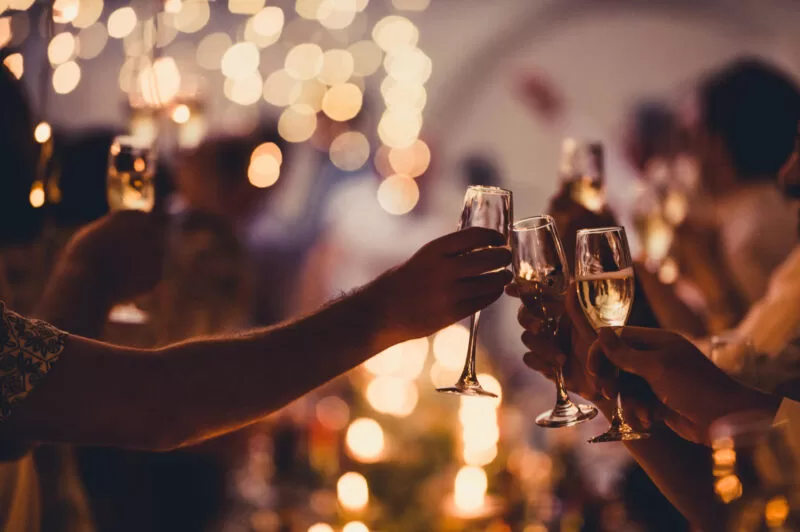 Celebratory Toast with String Lights and Champagne Silhouettes